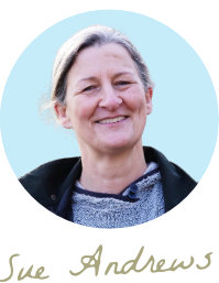 Photo of Sue from Sue Andrews Gardens smiling with blue sky and her signature